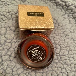 Flesh brand lipgloss in shade “ Enchantment.”